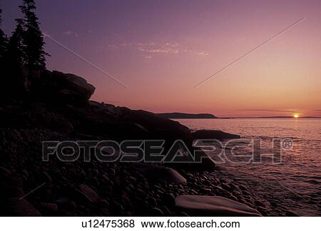 Stock Photo -  Acadia National Park, sunrise, Acadia, sunset, Maine, Atlantic Ocean, Scenic view of the rocky coastline at sunrise in Acadia Nat'l Park in the state of Maine.. Fotosearch