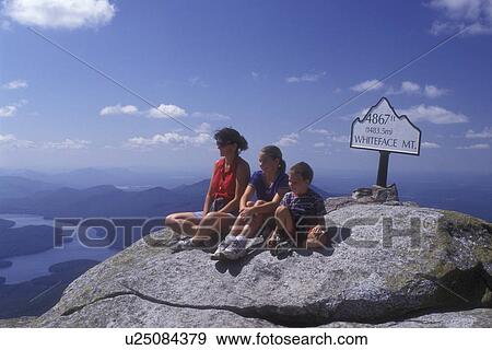 Adirondacks, summit, Whiteface Mt Adirondack Park, New York, Mother and children sit in front of elevation sign on the summit of Whiteface Mountain in Wilmington in the state of New York. View Large Photo Image Stock Photo - Adirondacks, summit, Whiteface Mt Adirondack Park, New York, Mother and children sit in front of elevation sign on the summit of Whiteface Mountain in Wilmington in the state of New York. . Fotosearch
