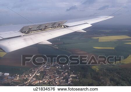 airplane, France, Europe, The wing of a US Airways plane flying over clouds above the scenic country of France getting ready for landing. View Large Photo Image Stock Photograph - airplane, France, Europe, The wing of a US Airways plane flying over clouds above the scenic country of France getting ready for landing.. Fotosearch