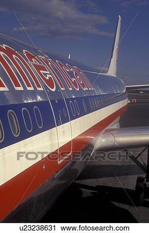 Stock Image -  Airport, Boston, Logan, Massachusetts, American Airlines airplane parked at gate at Logan Airport Terminal in Boston.. Fotosearch