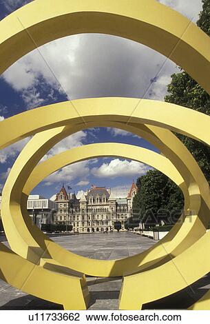 Stock Image -  Albany, State Capitol, State House, New York, A view of The State Capitol Building from a yellow oval sculpture at the Governor Nelson A. Rockefeller Empire State Plaza in Albany the capital city in the state of New York. . Fotosearch