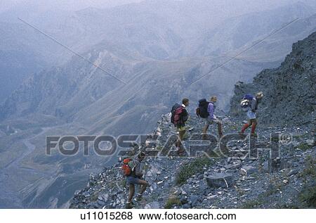 Alps, hiking, France, Europe, A group of hikers walking up along the rocky GR5 trail to Pas de la Cavale in the French Alps in Alpes-Maritimes. View Large Photo Image Stock Photo - Alps, hiking, France, Europe, A group of hikers walking up along the rocky GR5 trail to Pas de la Cavale in the French Alps in Alpes-Maritimes.. Fotosearch