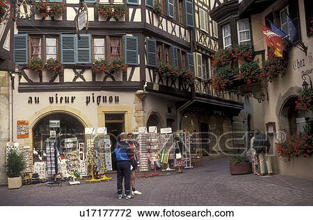 Alsace, France, Europe, Colmar, Haut Rhin, People shopping in the city of Colmar, capital of Haut Rhin, with its half-timbered houses (Alsatian-style buildings) with flowers in window boxes that line the narrow streets in downtown Colmar. View Large Photo Image Stock Image - Alsace, France, Europe, Colmar, Haut Rhin, People shopping in the city of Colmar, capital of Haut Rhin, with its half-timbered houses (Alsatian-style buildings) with flowers in window boxes that line the narrow streets in downtown Colmar. . Fotosearch