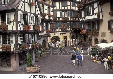 Alsace, France, Europe, Colmar, Haut Rhin, People shopping in the city of Colmar, capital of Haut Rhin, with its half-timbered houses (Alsatian-style buildings) with flowers in window boxes that line the narrow streets in downtown. View Large Photo Image Stock Photograph - Alsace, France, Europe, Colmar, Haut Rhin, People shopping in the city of Colmar, capital of Haut Rhin, with its half-timbered houses (Alsatian-style buildings) with flowers in window boxes that line the narrow streets in downtown. . Fotosearch