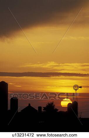 Stock Image -  amish, farm, Amish country, Lancaster County, silhouette, Pennsylvania, Pennsylvania Dutch Country, A silhouette of an Amish farm at sunset in Lancaster in the state of Pennsylvania. . Fotosearch