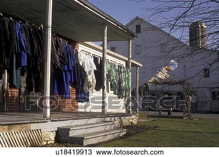 Stock Image -  Amish, laundry, Amish Country, Pennsylvania Dutch Country, Lancaster, Pennsylvania, Clothes drying on a porch of a an Amish house on laundry day in Lancaster County in the state of Pennsylvania.. Fotosearch