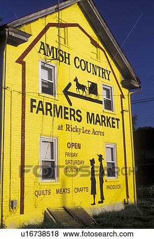 Stock Photo -  amish, mural, Lancaster County, Pennsylvania, Yellow painted mural on side of a building advertsing the Amish Country Farmers Market in Pennsylvania Dutch Country in the state of Pennsylvania. . Fotosearch