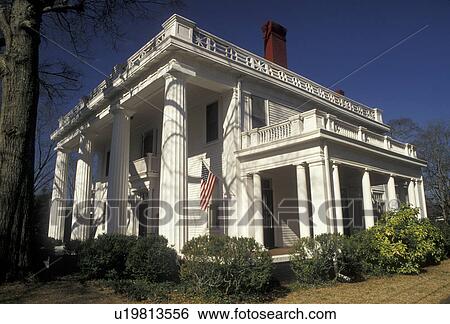 Stock Photograph -  antebellum, Madison, mansion, Georgia, An Antebellum house with white columns in the Historic District of Madison in the state of Georgia.. Fotosearch