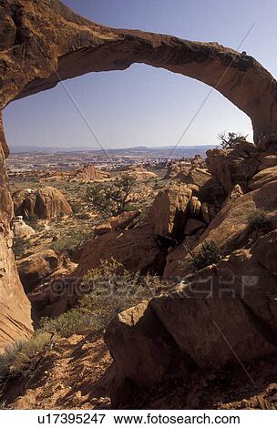 Arches, natural stone arch, Arches National Park, Utah, Landscape Arch, one of the longest natural stone arches in the world, in Arches Nat'l Park in the state of Utah. View Large Photo Image Stock Photo - Arches, natural stone arch, Arches National Park, Utah, Landscape Arch, one of the longest natural stone arches in the world, in Arches Nat'l Park in the state of Utah.. Fotosearch