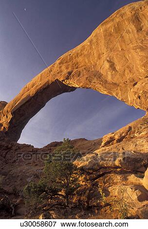 Arches, natural stone arch, Arches National Park, Utah, Crescent moon over South Window Arch a natural rock formation in Arches Nat'l Park in the state of Utah. View Large Photo Image Stock Photo - Arches, natural stone arch, Arches National Park, Utah, Crescent moon over South Window Arch a natural rock formation in Arches Nat'l Park in the state of Utah.. Fotosearch