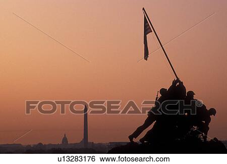 Arlington, Iwo Jima, National Cemetery, Virginia, Silhouette of the raising of the U. S. flag at Iwo Jima, The Marine Corps War Memorial in Arlington Nat'l Cemetery in the morning in Arlington in the state of Virginia. The Washington Monument stands in th View Large Photo Image Stock Photograph - Arlington, Iwo Jima, National Cemetery, Virginia, Silhouette of the raising of the U. S. flag at Iwo Jima, The Marine Corps War Memorial in Arlington Nat'l Cemetery in the morning in Arlington in the state of Virginia. The Washington Monument stands in th. Fotosearch