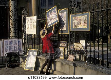 artist, Charleston, South Carolina, An artist hangs her paintings on a fence on Church Street for display in Charleston in the state of South Carolina. View Large Photo Image Stock Photo - artist, Charleston, South Carolina, An artist hangs her paintings on a fence on Church Street for display in Charleston in the state of South Carolina. . Fotosearch