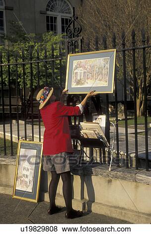 artist, Charleston, South Carolina, An artist hangs her paintings on a fence on Church Street for display in Charleston in the state of South Carolina. View Large Photo Image Stock Photo - artist, Charleston, South Carolina, An artist hangs her paintings on a fence on Church Street for display in Charleston in the state of South Carolina. . Fotosearch