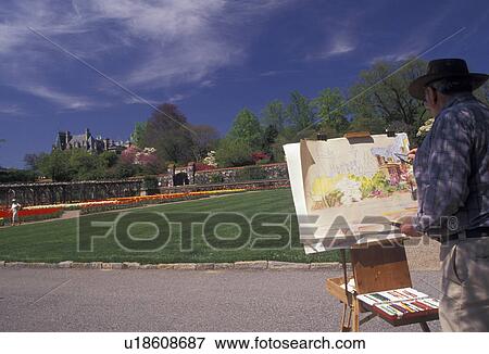 Stock Photo -  Asheville, Biltmore Estate, artist, Biltmore, North Carolina, Artist painting a picture of the Biltmore House inside the Walled flower Garden in the spring at Biltmore Estate in Asheville in the state of North Carolina.. Fotosearch