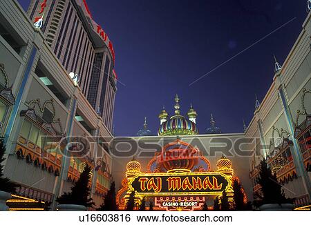 Stock Photograph -  Atlantic City, casino, New Jersey, The entrance to Trump Taj Mahal Casino and Resort illuminated in the evening in Atlantic City in the state of New Jersey.. Fotosearch
