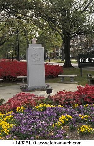 Stock Image -  Augusta, Georgia, War memorial and gardens of red azaleas, purple and yellow flowers in the spring in Augusta in the state of Georgia.. Fotosearch