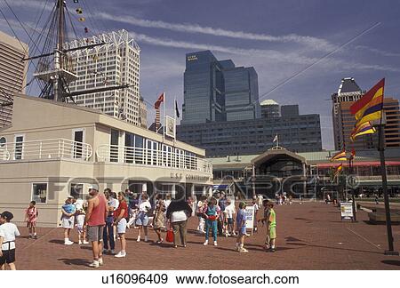 Stock Photo -  Baltimore, Inner Harbor, Maryland, People walking along Harborplace on the Inner Harbor in downtown Baltimore in the state of Maryland. Fotosearch