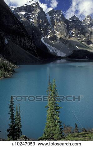 Banff National Park, glacier lake, mountains, Canada, Alberta, A scenic view of Lake Moraine and the surrounding snow-capped mountains in Banff National Park. View Large Photo Image Stock Photo - Banff National Park, glacier lake, mountains, Canada, Alberta, A scenic view of Lake Moraine and the surrounding snow-capped mountains in Banff National Park.. Fotosearch