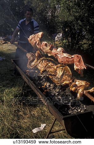 barbecuing, Chile, Chiloe Island, Outdoor barbecue for the Festival Costumbrista on Chiloe Island in Chile. View Large Photo Image Stock Photo - barbecuing, Chile, Chiloe Island, Outdoor barbecue for the Festival Costumbrista on Chiloe Island in Chile.. Fotosearch