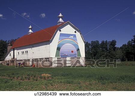 Stock Photo -  barn, mural, Wisconsin, A mural painting of a rainbow on a big white barn with red roof in Washburn in the state of Wisconsin.. Fotosearch