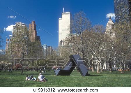 Battery Park, New York City, Manhattan, New York, N. Y. C Lower Manhattan skyline and people enjoying Battery Park on a warm spring day in New York City, New York. View Large Photo Image Stock Image -  Battery Park, New York City, Manhattan, New York, N. Y. C Lower Manhattan skyline and people enjoying Battery Park on a warm spring day in New York City, New York.. Fotosearch