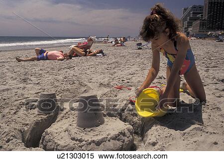 beach, Atlantic City, New Jersey, Atlantic Ocean, Young girl building a castle in the sand at the beach in Atlantic City in the state of New Jersey. View Large Photo Image Stock Photography - beach, Atlantic City, New Jersey, Atlantic Ocean, Young girl building a castle in the sand at the beach in Atlantic City in the state of New Jersey. . Fotosearch