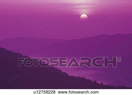 Blue Ridge, Blue Ridge Parkway, sunrise, sunset, North Carolina, Appalachian Mountains, Scenic view of fog over the mountains at sunrise from the Blue Ridge Pkwy in the state of North Carolina. (purple filter) View Large Photo Image Stock Photo - Blue Ridge, Blue Ridge Parkway, sunrise, sunset, North Carolina, Appalachian Mountains, Scenic view of fog over the mountains at sunrise from the Blue Ridge Pkwy in the state of North Carolina. (purple filter) . Fotosearch