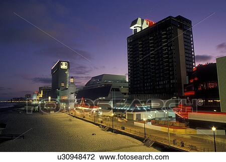 boardwalk, Atlantic City, New Jersey, Amusements, casino hotels, stores, and concessions along the famous Boardwalk in Atlantic City illuminated at night in the state of New Jersey. View Large Photo Image Stock Image - boardwalk, Atlantic City, New Jersey, Amusements, casino hotels, stores, and concessions along the famous Boardwalk in Atlantic City illuminated at night in the state of New Jersey. . Fotosearch
