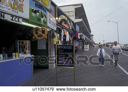 boardwalk, Ocean City, Maryland, Atlantic Ocean, People walk along the boardwalk next to shops in Ocean City in the state of Maryland. View Large Photo Image Stock Photo - boardwalk, Ocean City, Maryland, Atlantic Ocean, People walk along the boardwalk next to shops in Ocean City in the state of Maryland. . Fotosearch