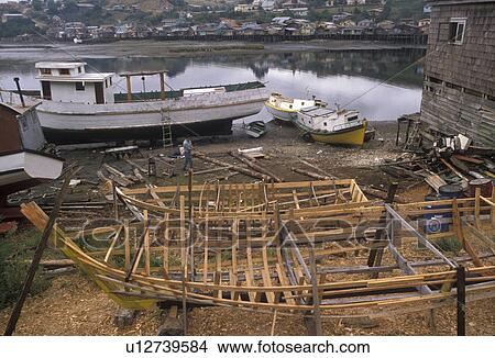 Picture -  boats, Chile, Chiloe Island, Fishing boats under construction in Castro on Chiloe Island in Chile.. Fotosearch