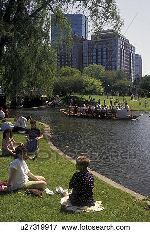 Boston, Boston Public Garden, swan paddleboat, Massachusetts, People enjoying a sunny day in Boston Public Garden in Boston in the state of Massachusetts. Swan boat carrying passengers on the pond and downtown skyline in the distance. View Large Photo Image Stock Photo - Boston, Boston Public Garden, swan paddleboat, Massachusetts, People enjoying a sunny day in Boston Public Garden in Boston in the state of Massachusetts. Swan boat carrying passengers on the pond and downtown skyline in the distance.. Fotosearch