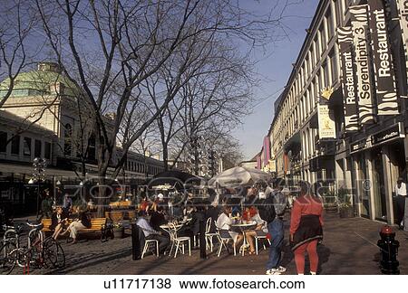 Stock Photo -  Boston, outdoor cafe, Quincy Market, Massachusetts, marketplace, People dining at an outdoor cafe at the Quincy Marketplace in downtown Boston in the state of Massachusetts.. Fotosearch