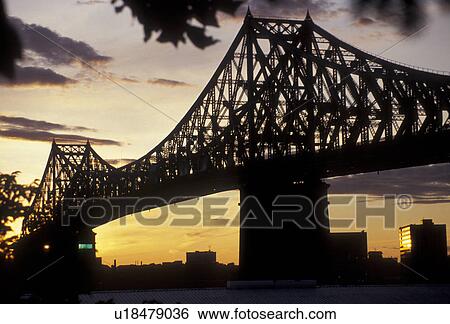 Stock Photograph -  bridge, Montreal, Quebec, Canada, a view of Jacques-Cartier Bridge (Pont Jacques-Cartier) crossing the Saint Lawrence Seaway at sunset in Montreal in the Province of Quebec, Canada.. Fotosearch