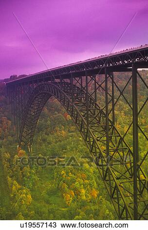 bridge, West Virginia, New River Gorge Bridge (a steel-arch span bridge) in the autumn (purple filter) in Fayetteville in the state of West Virginia., View Large Photo Image Stock Image - bridge, West Virginia, New River Gorge Bridge (a steel-arch span bridge) in the autumn (purple filter) in Fayetteville in the state of West Virginia., . Fotosearch