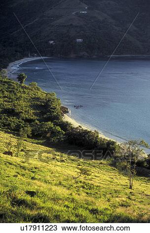 Stock Image -  British Virgin Islands, Tortola, Caribbean, Virgin Islands, BVI, B. V. I Scenic view of Brewer's Bay and the beach from the hillside on the island of Tortola on the British Virgin Islands.. Fotosearch