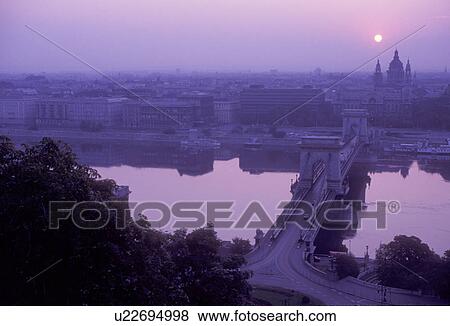 Stock Photo -  Budapest, Hungary, Europe, Scenic aerial view of the Chain Bridge, the Danube (Donau) River and the capital city of Budapest at sunrise.. Fotosearch