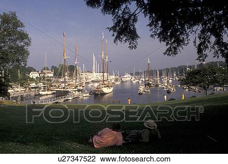 Camden, harbor, Maine, Atlantic Ocean, A couple sits on the lawn of a public park looking out at the scenic harbor in the seaside town of Camden in the state of Maine. View Large Photo Image Stock Image - Camden, harbor, Maine, Atlantic Ocean, A couple sits on the lawn of a public park looking out at the scenic harbor in the seaside town of Camden in the state of Maine.. Fotosearch
