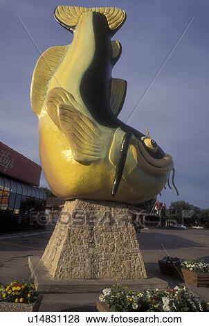 Stock Photo -  Canada, Manitoba, Selkirk, Giant statue of Chuck The Channel Catfish on Main Street greets visitors to Selkirk.. Fotosearch