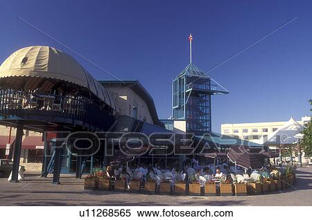 Stock Photography -  Canada, Manitoba, Winnipeg, Cafe outside The Johnston Terminal at the Forks in Winnipeg houses the Manitoba Sports Hall of Fame and Curling Hall of Fame.. Fotosearch