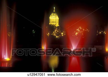 Stock Image -  Canada, Manitoba, Winnipeg, Lights illuminate the fountain and the Manitoba Legislative Building in Winnipeg at night (evening).. Fotosearch