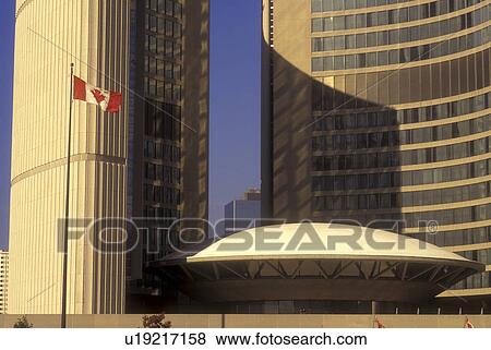 Stock Photo -  Canada, Ontario, Toronto, Canadian flag flies at the New City Hall in downtown Toronto.. Fotosearch