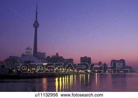 Canada, Ontario, Toronto, Skyline of downtown Toronto and CN Tower reflect in the waters of Lake Ontario in the evening. View Large Photo Image Stock Photograph - Canada, Ontario, Toronto, Skyline of downtown Toronto and CN Tower reflect in the waters of Lake Ontario in the evening.. Fotosearch