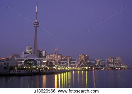 Canada, Ontario, Toronto, Skyline of downtown Toronto and CN Tower reflect in the waters of Lake Ontario in the evening. View Large Photo Image Stock Photograph - Canada, Ontario, Toronto, Skyline of downtown Toronto and CN Tower reflect in the waters of Lake Ontario in the evening.. Fotosearch