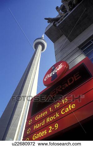 Stock Image -  Canada, Ontario, Toronto, View of CN Tower from Skydome in Toronto. Coca-Cola sign outside Skydome.. Fotosearch