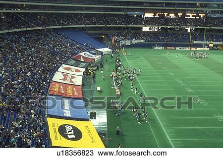 Canada, Ontario, Toronto, View of football game taking place inside Skydome (stadium) from Hard Rock Cafe in Toronto. View Large Photo Image Stock Image - Canada, Ontario, Toronto, View of football game taking place inside Skydome (stadium) from Hard Rock Cafe in Toronto.. Fotosearch
