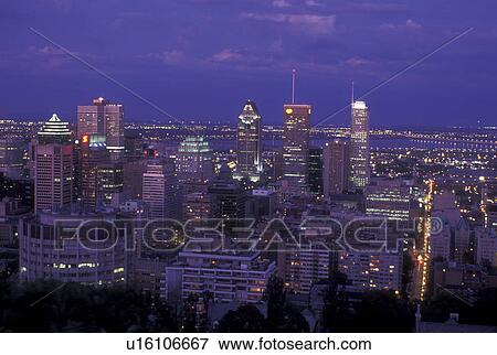 Canada, Quebec, Montreal, Aerial of the downtown skyline of Montreal from Mount Royal illuminated in the evening. View Large Photo Image Stock Photo - Canada, Quebec, Montreal, Aerial of the downtown skyline of Montreal from Mount Royal illuminated in the evening. . Fotosearch