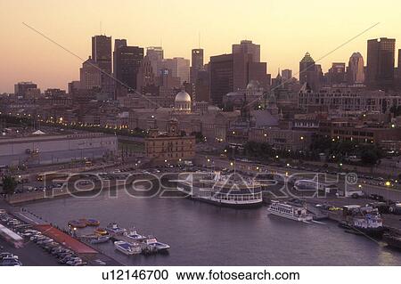 Canada, Quebec, Montreal, Aerial view of Vieux Port and the skyline of downtown Montreal on the waters of St. Lawrence River (Fleuve Saint-Laurent) in the evening. View Large Photo Image Stock Image - Canada, Quebec, Montreal, Aerial view of Vieux Port and the skyline of downtown Montreal on the waters of St. Lawrence River (Fleuve Saint-Laurent) in the evening.. Fotosearch