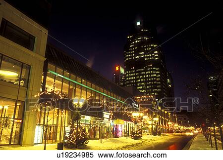Stock Photography -  Canada, Quebec, Montreal, Downtown Montreal illuminated at night (evening).. Fotosearch