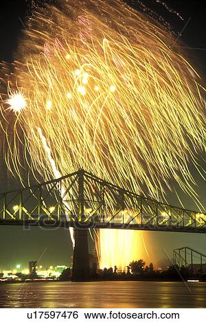 Canada, Quebec, Montreal, Firework display from the Benson & Hedges International Firework Competition reflects on the St. Lawrence River (Fleuve Saint-Laurent) at night in Montreal. Pont Jacques Cartier. View Large Photo Image Stock Photograph - Canada, Quebec, Montreal, Firework display from the Benson & Hedges International Firework Competition reflects on the St. Lawrence River (Fleuve Saint-Laurent) at night in Montreal. Pont Jacques Cartier.. Fotosearch