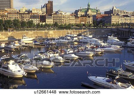 Canada, Quebec, Montreal, Marina at Vieux Port and skyline of Vieux Montreal on the waters of St. Lawrence River (Fleuve Saint-Laurent). View Large Photo Image Stock Photo - Canada, Quebec, Montreal, Marina at Vieux Port and skyline of Vieux Montreal on the waters of St. Lawrence River (Fleuve Saint-Laurent).. Fotosearch
